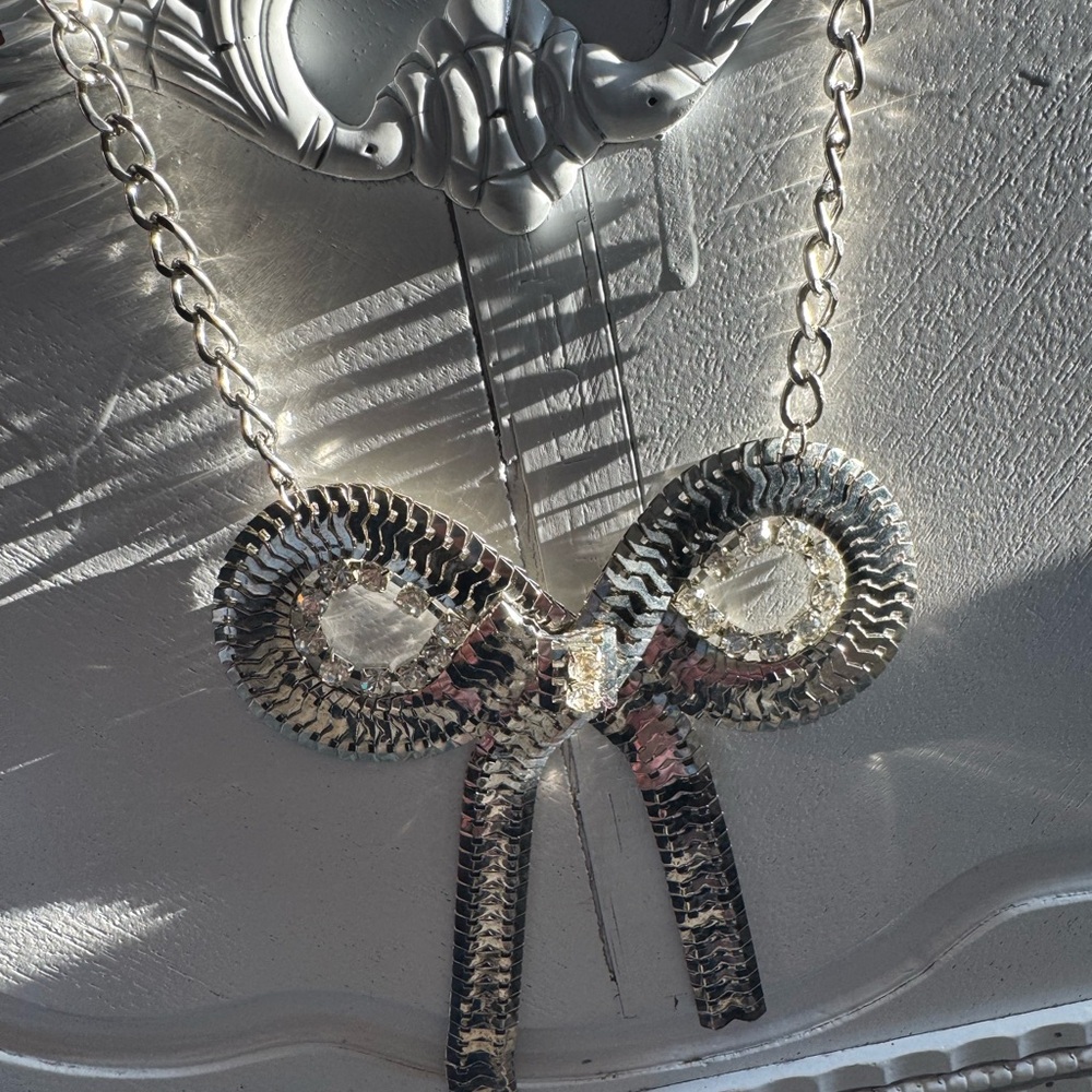 Silver-Tone Flexible Bow Necklace with Rhinestones